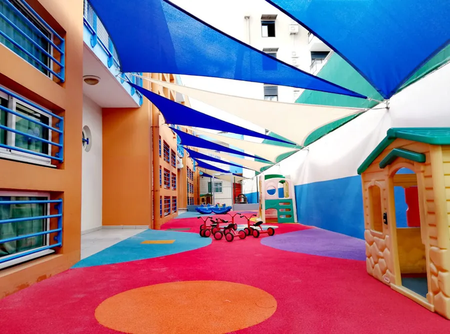 Multiple shade sails protecting young kids.webp width=900 height=688